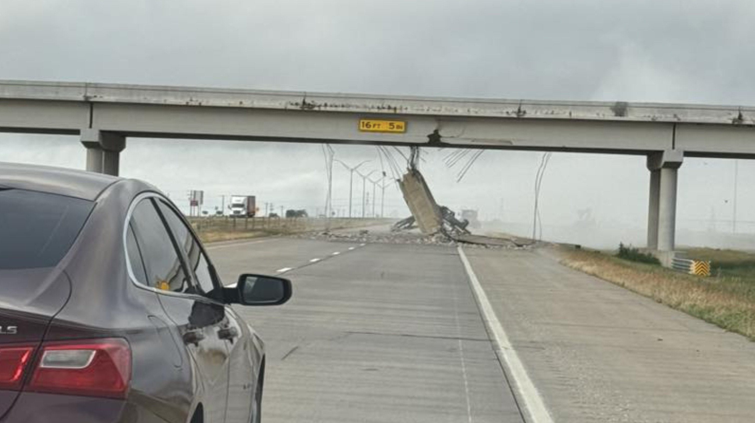 Semi Hauling Crane Crashes Into Overpass, Snarls Traffic on I-27 Semi Hauling Crane Crashes Into Overpass, Snarls Traffic on I-27