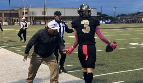 Post Coaching Staff Congratulates Antelopes' Maxx Cole after a big play against Olton