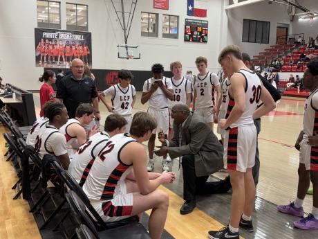Lubbock-Cooper Head Coach Will Flemons talking to the Pirates during a timeout