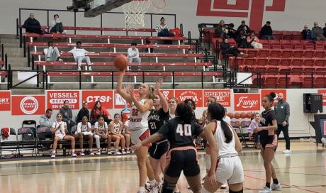 Lubbock Cooper Lady Pirates' Hannah Campbell scoring a layup against the Caprock Lady Longhorns