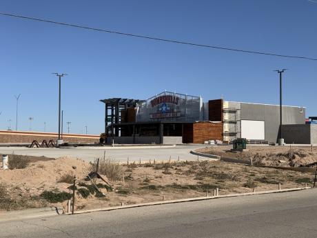 Lubbock Bombshells adds signs to building and along TX 327 Spur