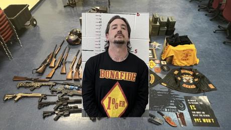 Andrew Burdett Moore, 37, was arrested for a first-degree child felony charge, weapons, and gang memorabilia 