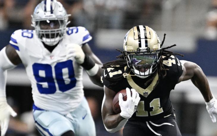 New Orleans Saints Alvin Kamara runs away from the Dallas Cowboys Defense