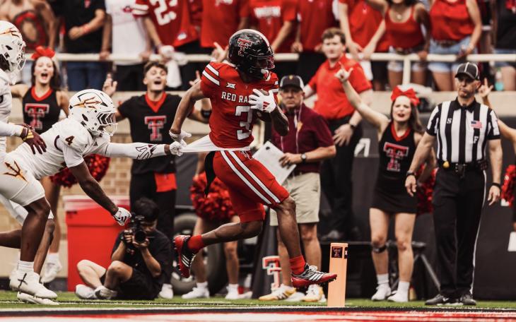 Texas Tech's Josh Kelly scores against Arizona State