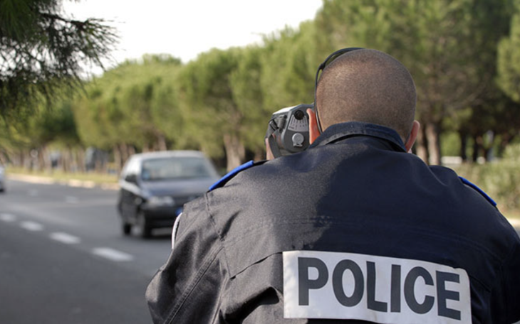 Speed Patrol Officer Using Radar For Speeding Motorists