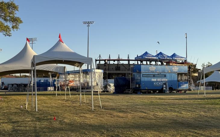 Big Noon Kickoff stage being set up across from Dan Law Field at Rip Griffin Park