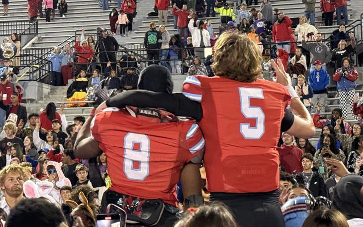 Lubbock Monterey's Kyree Baxter (left) and Luke Arrington (right) celebrate a win over Abilene High on senior night.