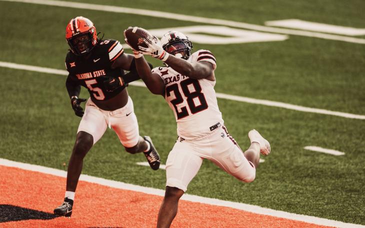 Texas Tech's Tahj Brooks scores against Oklahoma State