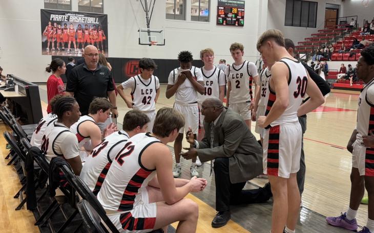 Lubbock-Cooper Head Coach Will Flemons talking to the Pirates during a timeout