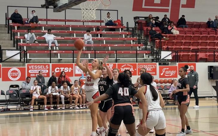 Lubbock Cooper Lady Pirates' Hannah Campbell scoring a layup against the Caprock Lady Longhorns