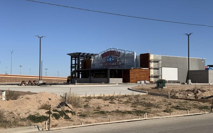 Lubbock Bombshells adds signs to building and along TX 327 Spur