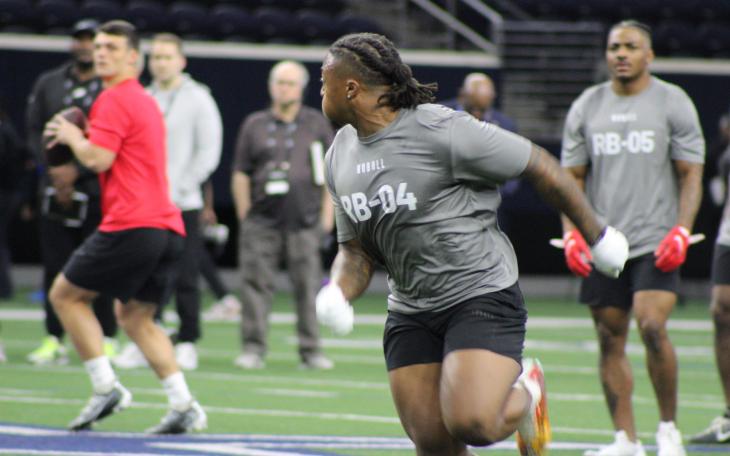 Tahj Brooks Mid-Action During a Running Back Drill