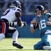 Texans linebacker Azeez Al-Shaair delivers a late hit on Jaguars quarterback Trevor Lawrence